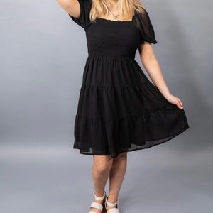 Black smocked dress. New with tags. Short sleeves.